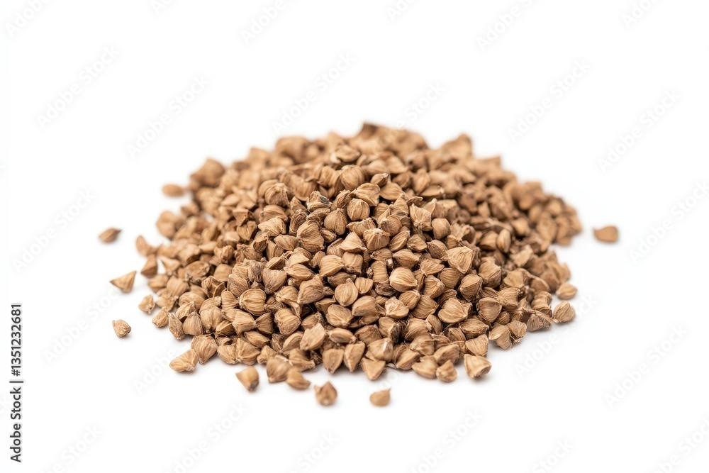 A Small Pile of Brown Grains Resting on a White Surface A Small Pile of Brown Grains Resting on a White Surface