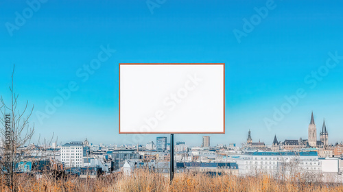 Blank billboard on an urban rooftop, clear sky, city skyline in the background, perfect advertising canvas 