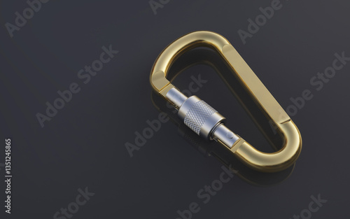 Vászonkép Golden carabiner on a dark background.