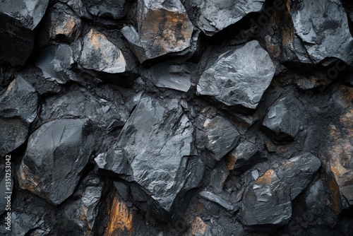 A close up image of a dark stone wall