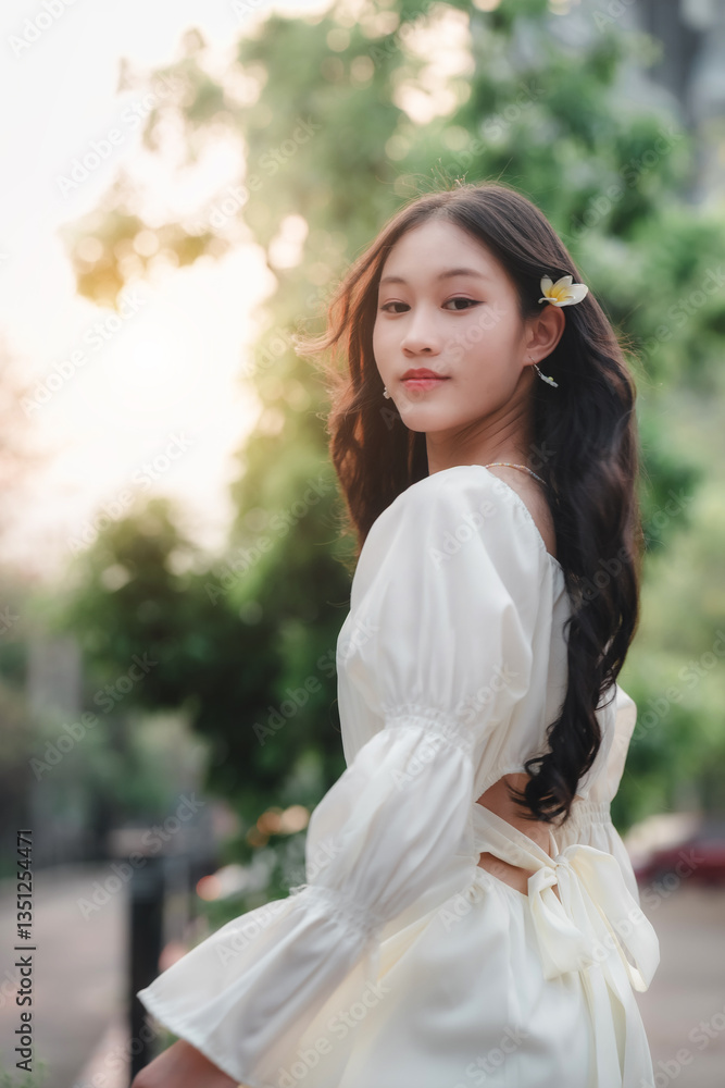 Girl in white dress strolling through urban park at sunset captivating portrait photography Girl in white dress strolling through urban park at sunset captivating portrait photography