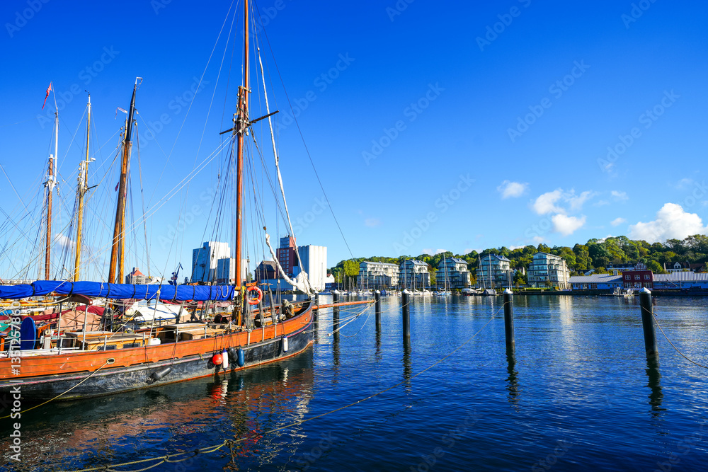 Obraz premium View of the historic harbor of the city of Flensburg and the surrounding landscape. Flensburg harbor on the fjord. 