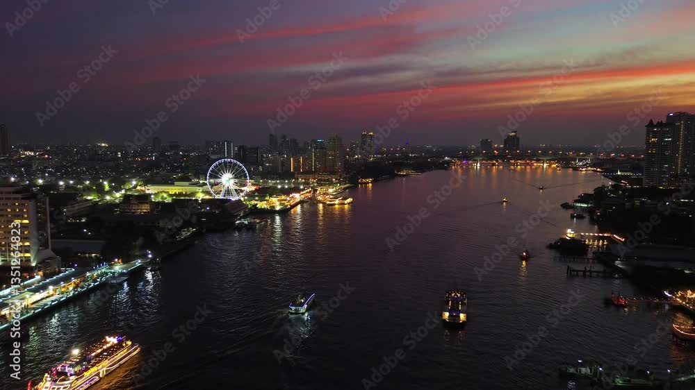 Aerial view of illuminated skyscrapers in Bangkok city and Chao Phraya River in night time, 4k Aerial view of illuminated skyscrapers in Bangkok city and Chao Phraya River in night time, 4k