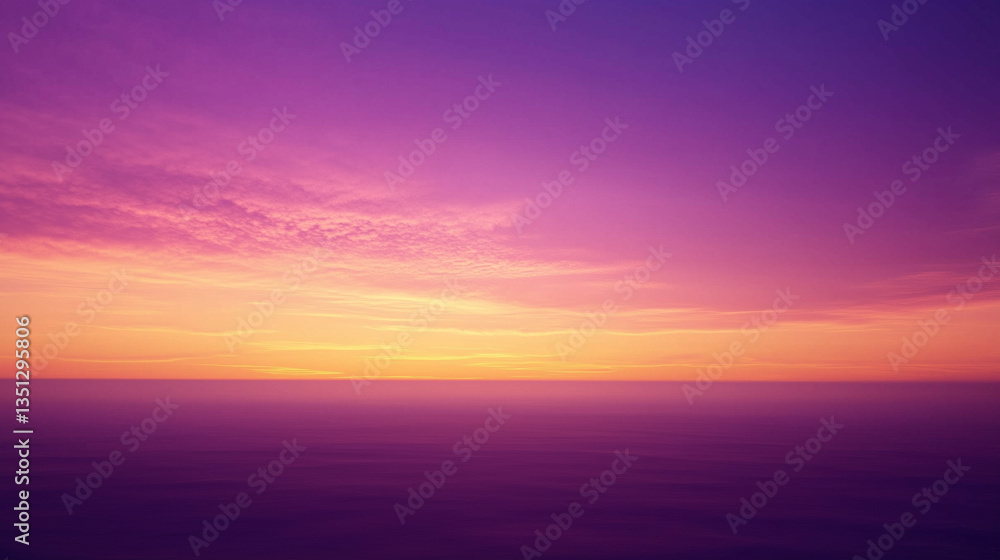 Fototapeta premium Vibrant sunset sky with fiery orange horizon blending into a serene purple twilight, capturing a peaceful and colorful atmospheric scene.