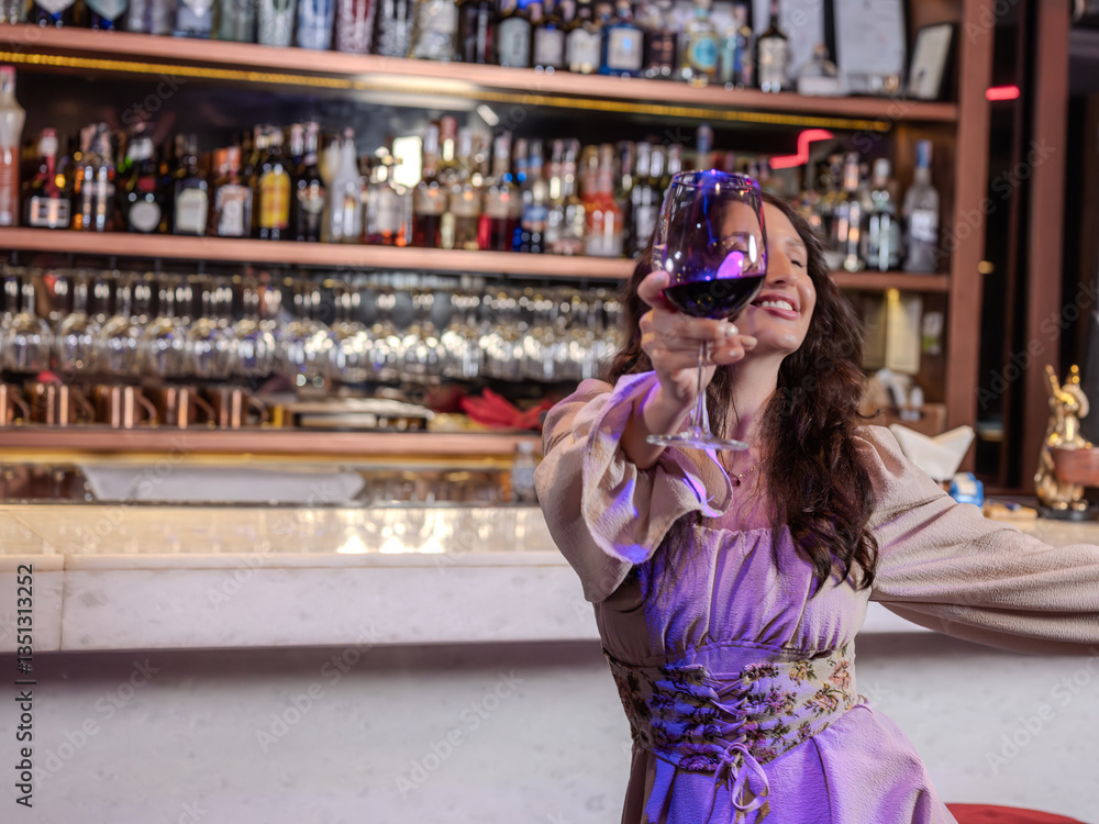woamn dancing happily in night life in a pub, restaurant, bar. Concept, relax, holiday.