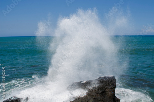 waves crashing on rocks