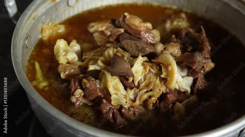 Process of cooking beef meat and bone, boiling meat to make it tender. Process of cooking beef meat and bone, boiling meat to make it tender.