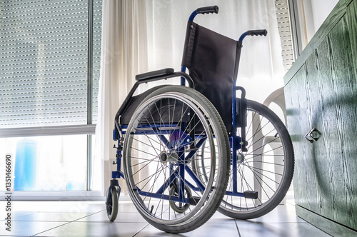 Empty wheelchair inside a room