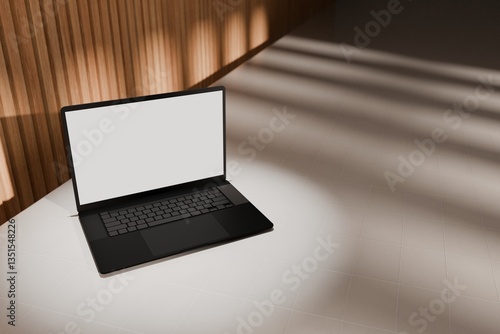 High end laptop on tile studio floor and acoustic backdrop. Blank mockup template screen. Spotlight from above