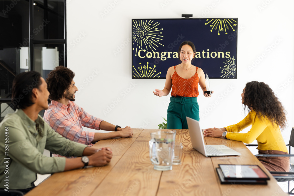 Presenting in office, Asian woman leading meeting, diverse colleagues celebrating success together Presenting in office, Asian woman leading meeting, diverse colleagues celebrating success together