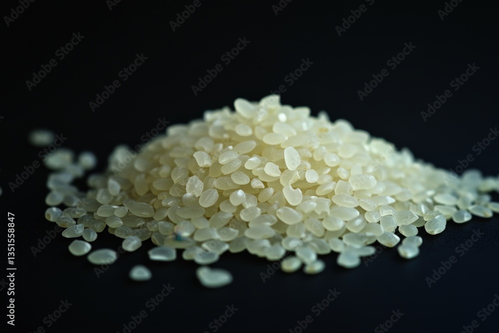 A close up image of uncooked white rice grains A close up image of uncooked white rice grains