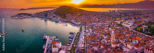 Panoramic view of Split, Croatia, showcasing its historic Old Town, and Adriatic coastline bathed in the warm hues of a stunning sunset, capturing the charm of this Dalmatian city