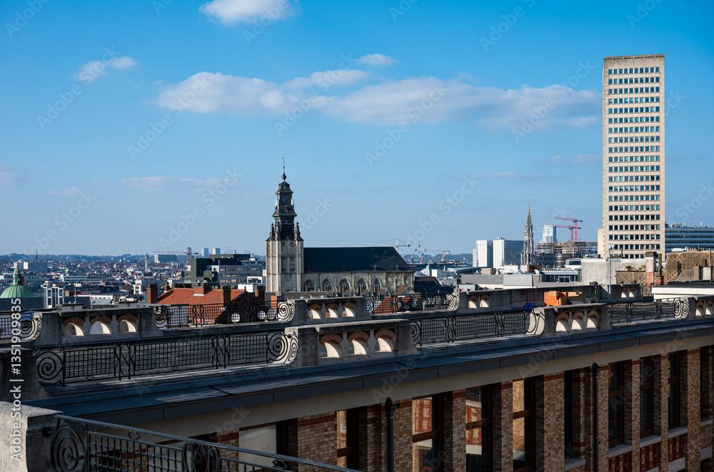 Fototapeta premium High angle view over the city with the Sablon tower and the our lady of the chapel church and the city hall tower, Brussels old town, Brussels Capital Region, Belgium