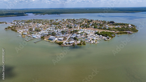 aerial view of Chokoloskee Island from west side, located at the edge of the Ten Thousand Islands and Everglades in Collier County, Florida,  connected to Everglades City on the mainland by a causeway
