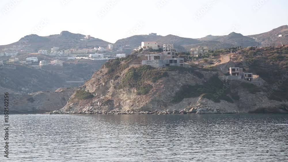 Explore a scenic coastal view featuring beautiful hills, charming houses, and vast ocean vistas Explore a scenic coastal view featuring beautiful hills, charming houses, and vast ocean vistas