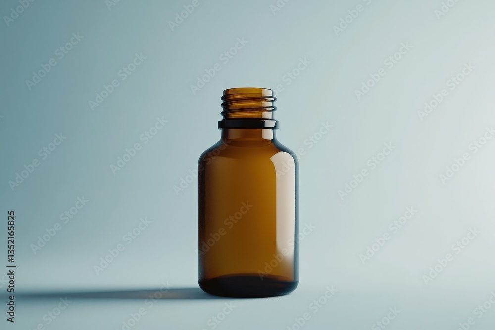 A clear amber glass bottle standing on a smooth surface A clear amber glass bottle standing on a smooth surface