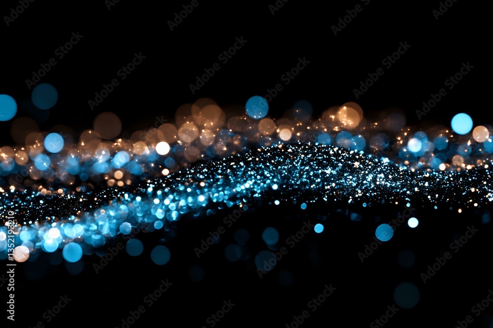 Fototapeta premium Abstract glowing blue and golden bokeh lights flowing on black background, creating magical sparkle effect with blurred particles and luminous wave motion.