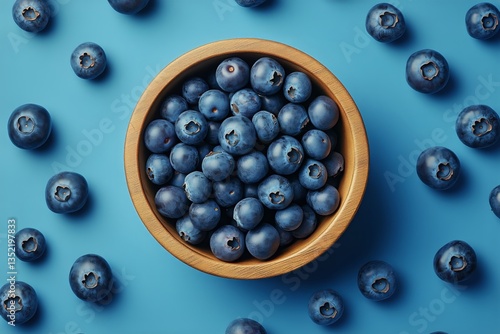 Fresh Blueberries Arranged in a Wooden Bowl on a Blue Background