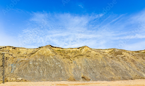 Fotografie Crumbling cliffs with landslips at Burton Bradstock, Dorset, UK