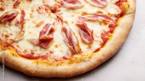 A close-up of melted cheese, crispy crust, and Parma ham ribbons on a pizza