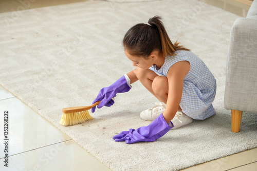 Cute little girl cleaning c...
