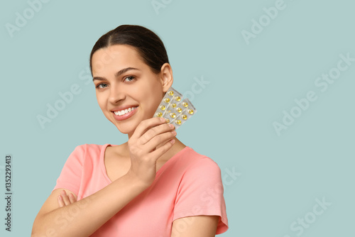 Pretty young woman holding ...