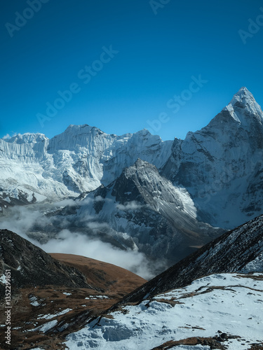 Himalayan snowy ridge and clouds from high trail