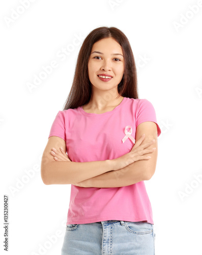 Young Asian woman with awareness pink ribbon on white background. Breast canc...
