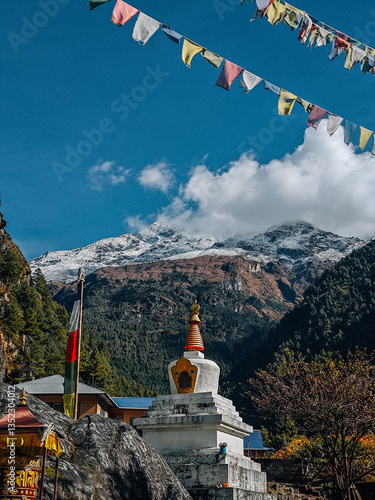 Stupa with prayer flags and Himalayan mountains