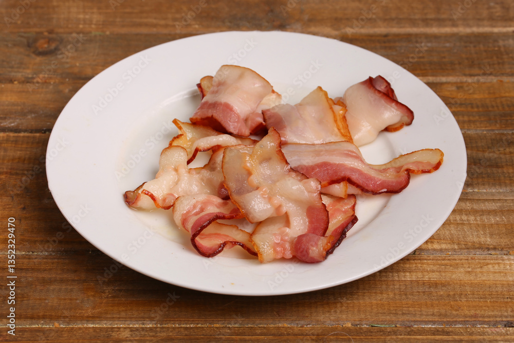 plate of fried bacon plate of fried bacon