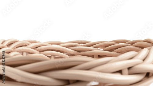Close-up shot of a woven basket texture. The image shows a detailed view of the interwoven strands, exhibiting a beige or cream color. The focus is sharp, highlighting the intricate pattern and