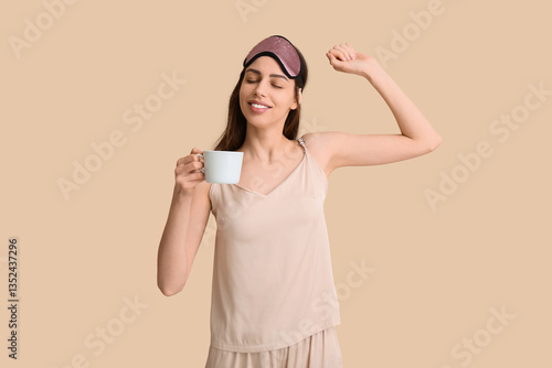 Young woman in pajamas with...
