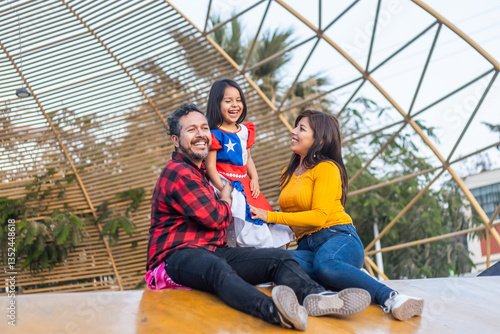 Cheerful chilean family celebrating national holidays, wearing traditional attire and sharing joyful moment together