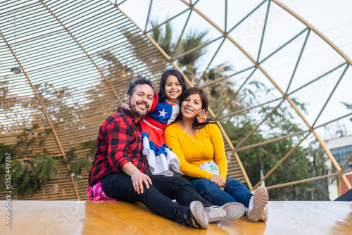 Tableau sur toile Happy family wearing traditional chilean clothing, celebrating their national ho