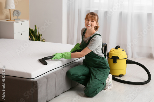 Female janitor cleaning mat...