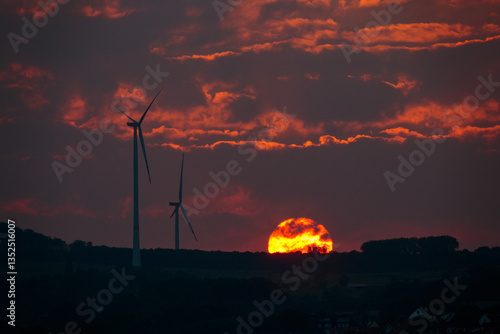 Wind Turbines And Sun At Sunset - Renewable Energy Concept