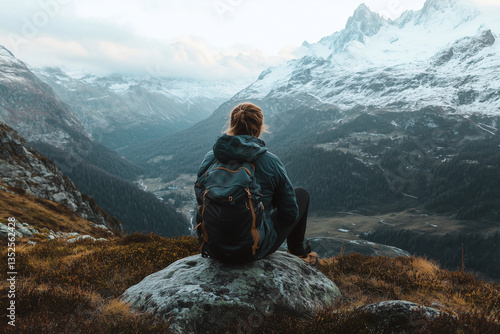 Wallpaper Mural person is sitting on a rock in the mountains with a backpack on. The person is looking out at the beautiful landscape, taking in the view Torontodigital.ca