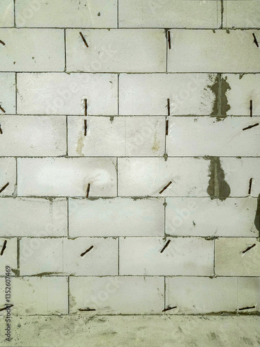 wall built of autoclaved aerated concrete bricks. copy space.