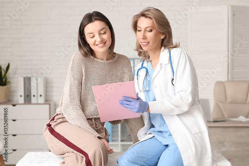 Female doctor showing clipb...