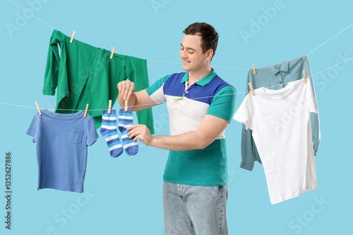 Handsome young man hanging ...
