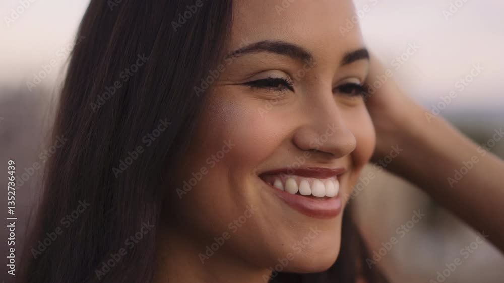 Close-up beauty portrait of smiling young woman with smooth healthy skin enjoying the sunset Close-up beauty portrait of smiling young woman with smooth healthy skin enjoying the sunset