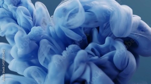 Immerse in the dynamic movement of blue smoke swirls creating an abstract background. These swirling forms offer a stunning visual display, inviting deep contemplation and wonder.