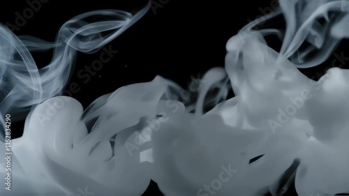 Witness the enchanting dance of smoke swirls against a dark background, creating a mesmerizing abstract display. The soft flowing shapes evoke a sense of calm and intrigue.