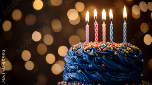 Blue frosted cake with colorful sprinkles and lit candles against a bokeh background, depicting celebration, joy, and festivity, perfect for birthday themes