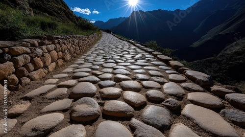 Ancient paved road, Andean mountains, sunlit path.  Stone pathways, historical Inca road,  winding up into the mountains, paved walkways,  high elevation