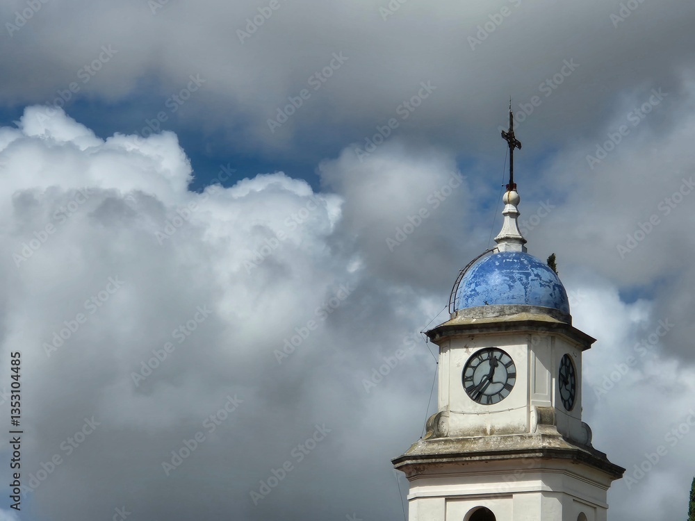 detail of a catholic church over a cloudy sky