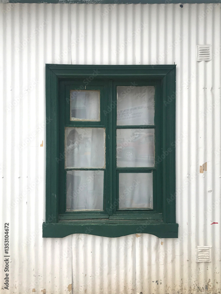 Wooden window in an old tin house in Argentine Patagonia