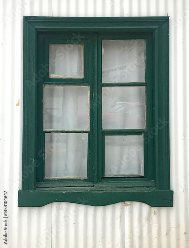 Wooden window in an old tin house in Argentine Patagonia