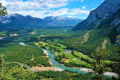 Beautiful landscape view to the river from the mountain at a sunny summer day