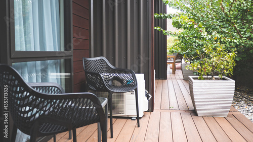 Building exterior outdoor deck chairs table in the garden relaxing place hotel yard balcony